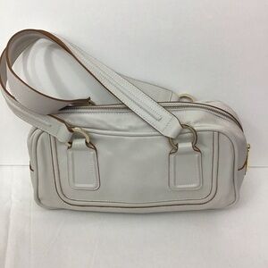 Monsac Genuine Leather off white handbag with gold tones.